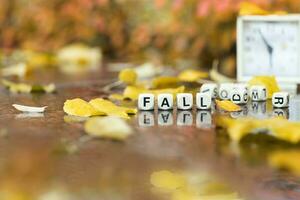 Word FALL is composed of wooden letters. photo