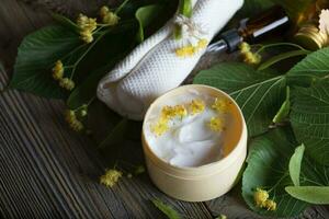 Face cream with linden blossoms. photo