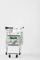 Pills in a mini shopping cart. photo