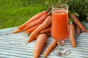 A glass of fresh carrot juice photo