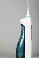 Cordless water flosser with jet tip. photo