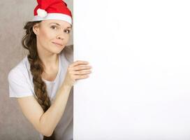 Young lady in Santa Claus hat photo