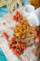 Softgels with rowan berries oil. photo