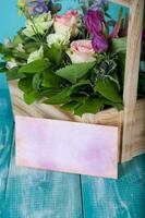 Woodenmade basket with beautiful flowers. photo