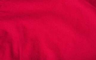 Red colored velvet fabric. Closeup photo