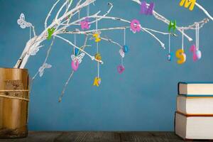 Colorful letters on tree twigs. photo