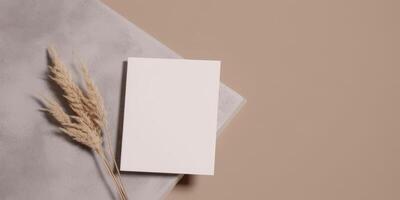 Mockup Paper Wedding Invitation Boho Minimal Style Greeting Card for Wedding Invitations and Birthday Stationery. Top View Flat Lay Copyspace. photo
