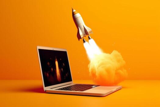 Laptop screen shoots rocket, orange backdrop, photo