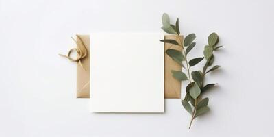 Minimalist Greeting Card Mockup with Delicate Dry Eucalyptus Leaves - Top View on a Clean White Background, AI Generated photo