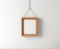 Blank Wooden Picture Frame Mockup Hanging on Wall Empty Poster Mockup for Art Display. Front View with Copy Space photo