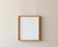 Blank Wooden Picture Frame Mockup Hanging on Wall Empty Poster Mockup for Art Display. Front View with Copy Space photo