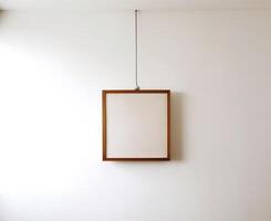 Blank Wooden Picture Frame Mockup Hanging on Wall Empty Poster Mockup for Art Display. Front View with Copy Space photo