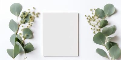 Minimalist Greeting Card Mockup with Delicate Dry Eucalyptus Leaves - Top View on a Clean White Background, AI Generated photo