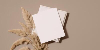 Mockup Paper Wedding Invitation Boho Minimal Style Greeting Card for Wedding Invitations and Birthday Stationery. Top View Flat Lay Copyspace. photo