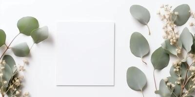 Minimalist Greeting Card Mockup with Delicate Dry Eucalyptus Leaves - Top View on a Clean White Background, AI Generated photo