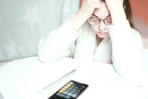 Lots of debt. Financial problem. Woman crying over debt photo