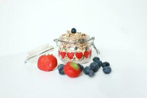 Granola in a jar. Granola with berries. Muesli photo