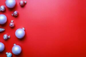 Pink toys for the Christmas tree on a red background. Christmas decorations photo