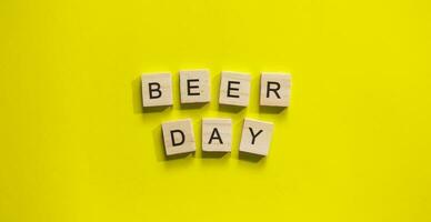 August 4, International Beer Day, minimalistic banner with the inscription in wooden letters Beer Day photo