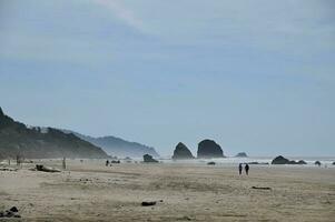 A view of Haystack Rock at Canon Beach Oregon photo