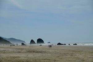 A view of Haystack Rock at Canon Beach Oregon photo