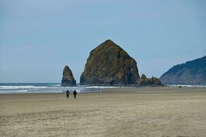 A view of Haystack Rock at Canon Beach Oregon photo