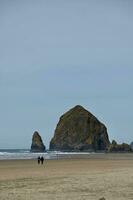 A view of Haystack Rock at Canon Beach Oregon photo