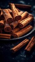 Generative AI Cinnamon sticks on a dark blue background. Selective focus. photo