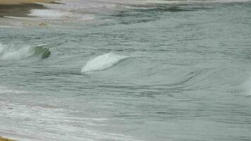 Seascape, azure wave rolls on the shore in Thailand. Tourism and travel concept video