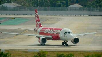 PHUKET, THAILAND DECEMBER 04, 2016 - AirAsia Airbus 320 9M AJX taxiing before departure Phuket airport. video