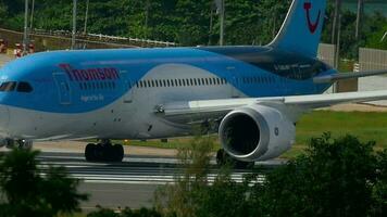 PHUKET, THAILAND NOVEMBER 26, 2016 - TUI Airways Thomson Boeing 787 Dreamliner G TUID turn runway before departure at Phuket airport. Rainy weather video