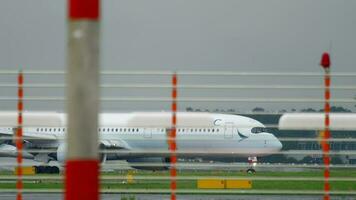 DUSSELDORF, GERMANY JULY 24, 2017 - Cathay Pacific Airbus A350 B LRB flight CPA379 from Hong Kong HKG taxiing after landing at rain. Dusseldorf Airport video