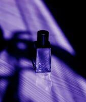 dark glass perfume bottle. photo