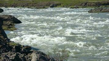 Fantastic landscape with flowing rivers and streams with rocks and grass in Iceland. video