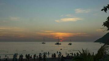 Timelapse of sunset on the ocean coast. Yachts and boats floating against the backdrop of a beautiful sunset sky. Travel and tourism concept video