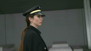 Female airline captain pilot officer in suit working at airport terminal video