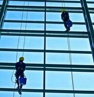 extreme work Cleaning the windows of buildings at height photo