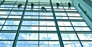 extreme work Cleaning the windows of buildings at height photo