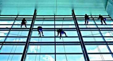 extreme work Cleaning the windows of buildings at height photo