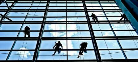 extreme work Cleaning the windows of buildings at height photo