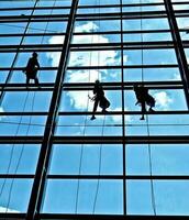 extreme work Cleaning the windows of buildings at height photo