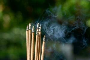 Incense sticks and smoke from incense burning. With copy space for text. photo