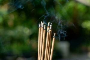 Burning Incense sticks with copy space for text or advertising photo