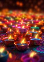 Lit diya candles against a colorful background. photo