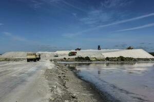 Extraction of raw material salt, from an open pit mine, La Pampa, Argentina photo