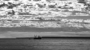 Ship in marine landscape at evening, Patagonia, Argentina. photo