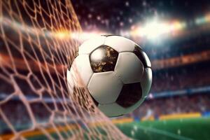 Soccer ball flew into net of the goal. photo