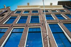 Facade of the Anne Frank house located at the Old Central district in Amsterdam photo