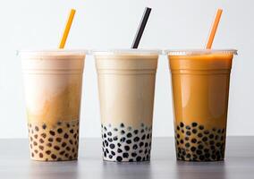 Generative AI illustration of product photo of 3 plastic cups of boba milk tea, with bubbles, fun, solid soft pastel background