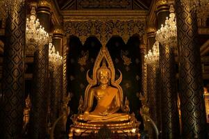 Beautiful golden Buddha situated in Wat Phra Sri Rattana Mahathat temple in Phitsanulok province of Thailand. photo